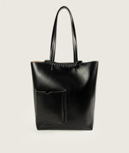 Load image into Gallery viewer, Pazar I Pazar Book Tote Grape Leather I Black with white Stitching I showing the iconic closure system and the outside book pocket I also showing the even more stable straps I white background