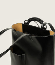 Load image into Gallery viewer, Pazar I Pazar Book Tote Grape Leather I Black with white Stitching I inside view I showing the iconic closure system and the inner pocket and the new even more stable straps I also showing the even more stable straps I white background