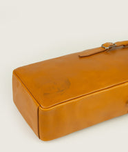Load image into Gallery viewer, GUT OGGAU x SAGAN Vienna bag white I white I view from top I showing the bag lying on the back, showing belt detail and Gut Oggau iconic Theodora embossing I white background