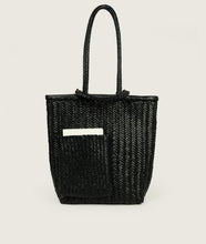 Load image into Gallery viewer, Woven I Pazar Book Tote Handwoven I black I front view I showing the iconic SAGAN closure strap and the front Book pocket I white background 