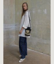 Load image into Gallery viewer, Vienna bucket bag, size S in black from Italian calf leather. Short signature hand knotted handle with additionally long thin removable shoulder strap. Inner pocket. D-key ring.